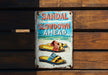 a sign on a wooden wall that says sandal slowdown ahead