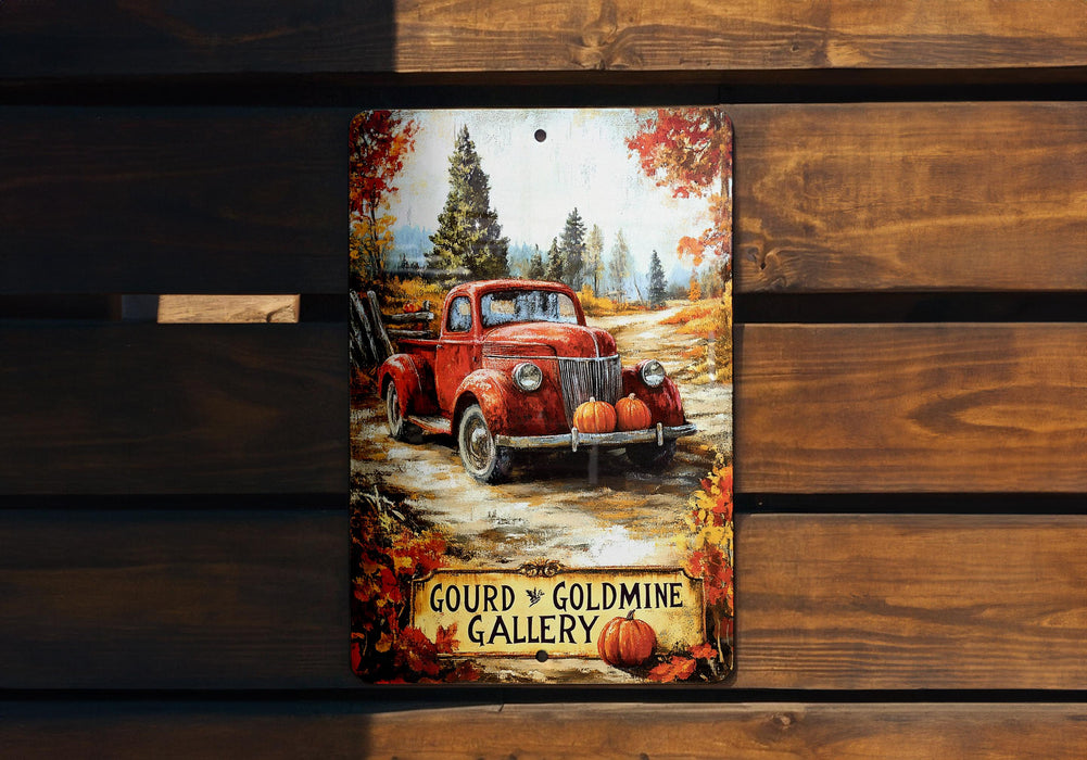 a picture of a red truck with pumpkins on it