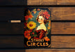 a poster of a woman with flowers on a wooden bench