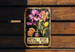 a sign on a wooden bench that says petal - dyed writing well