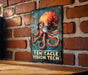 a picture of an octopus on a brick wall