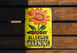 a sign on a wooden wall that says grow allergen warning