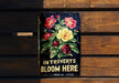 a sign on a wooden bench that says in provets bloom here