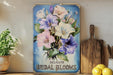a picture of a bouquet of flowers on a shelf