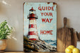 a painting of a lighthouse on a shelf