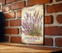 a sign on a brick wall that says purple fragrante heaven