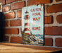 a sign on a brick wall that says guide your way home
