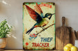 a painting of a hummingbird perched on a branch