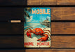 a picture of a crab on a sign on a bench