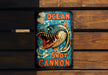 a sign on a wooden wall that says ocean not cannon