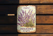 a sign on a wooden bench that says purple