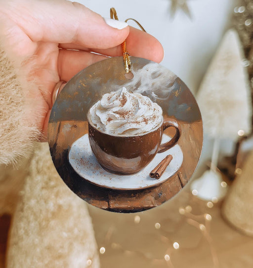 a person holding a cup of hot chocolate