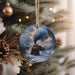 a christmas ornament hanging from a christmas tree