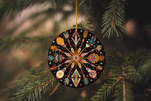 a christmas ornament hanging from a pine tree