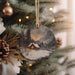 a christmas ornament hanging from a christmas tree