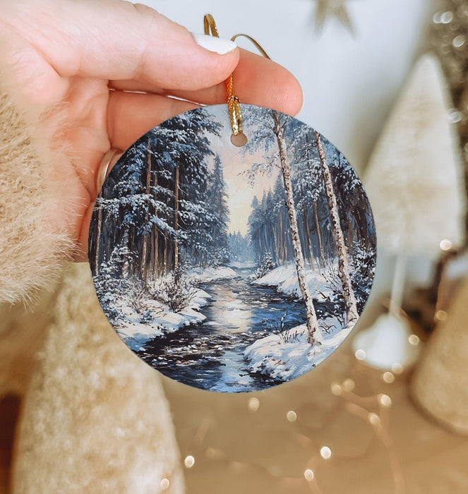 a person holding a christmas ornament in their hand