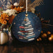 a christmas ornament with a christmas tree made of books