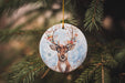 a ceramic ornament hanging from a christmas tree