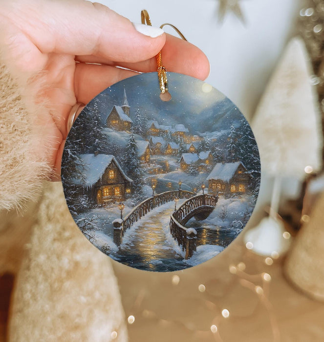 a person holding a christmas ornament in their hand