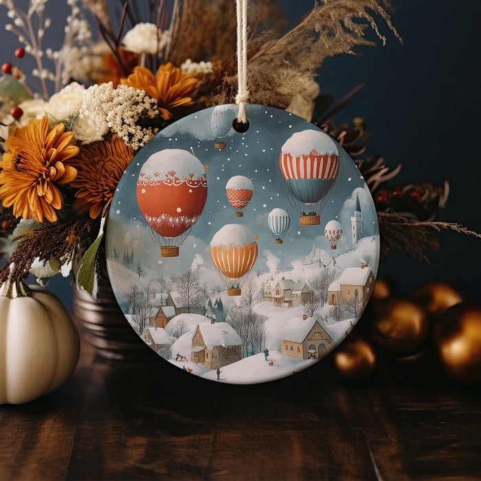 a christmas ornament with hot air balloons in the sky
