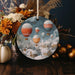 a christmas ornament with hot air balloons in the sky