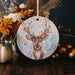 a ceramic ornament with a picture of a deer on it