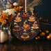 a wooden ornament with coffee cups on it