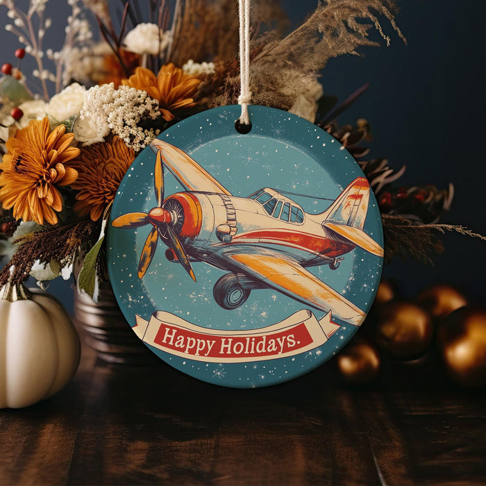 a christmas ornament with an airplane on it