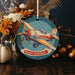 a christmas ornament with an airplane on it