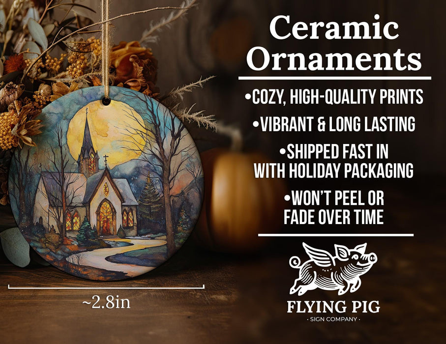 a ceramic ornament with a painting of a church