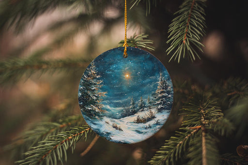 a glass ornament hanging from a christmas tree