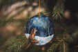 a glass ornament with a fox on it