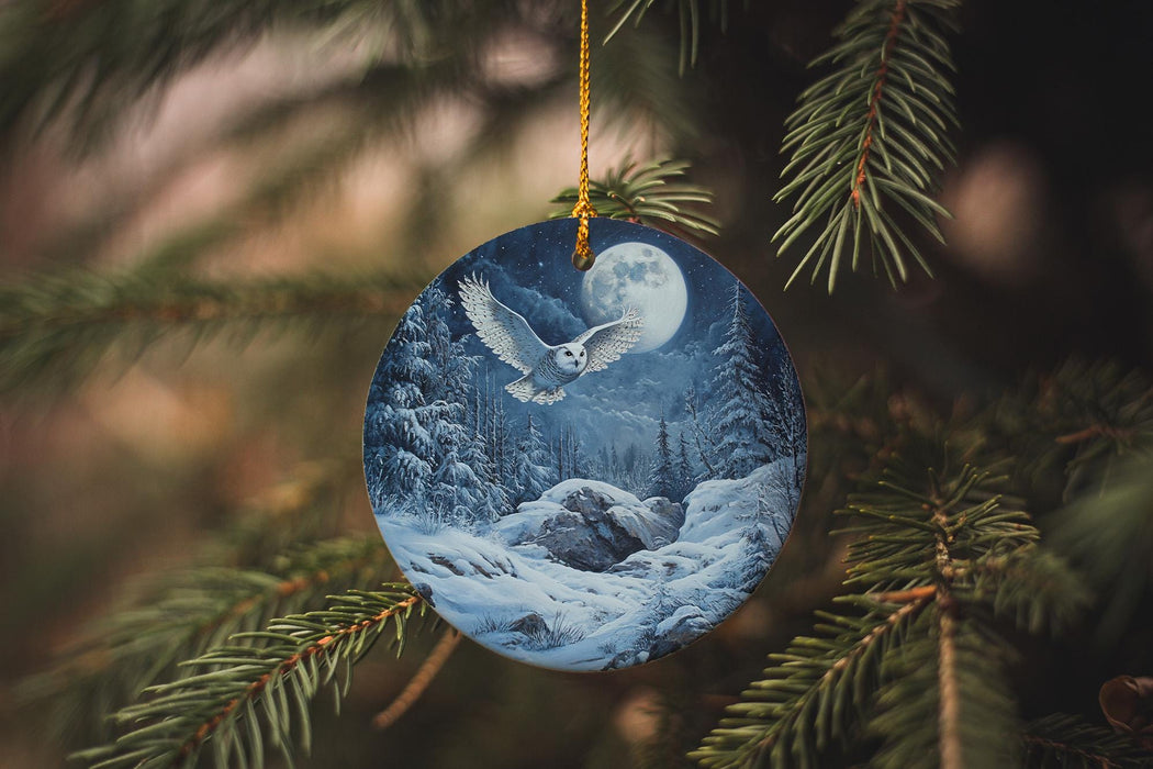a ceramic ornament hanging from a christmas tree