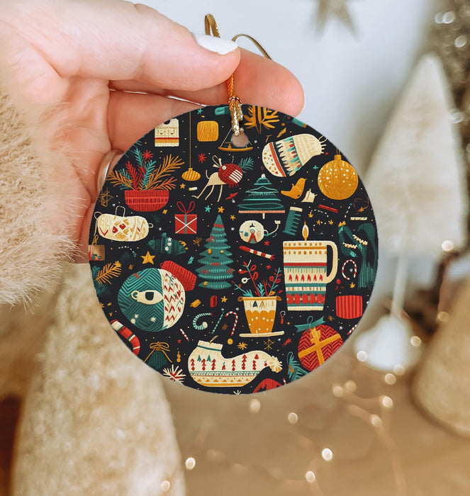 a person holding a christmas ornament in their hand