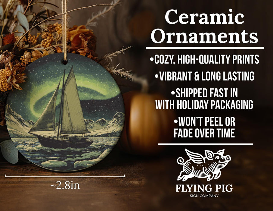 a ceramic ornament with a sailboat in the ocean