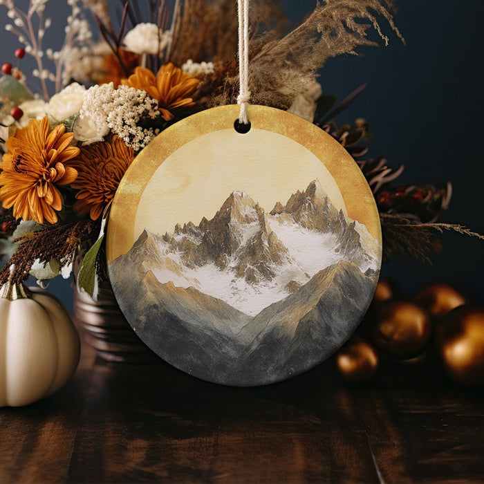 a picture of a mountain is hanging from a string