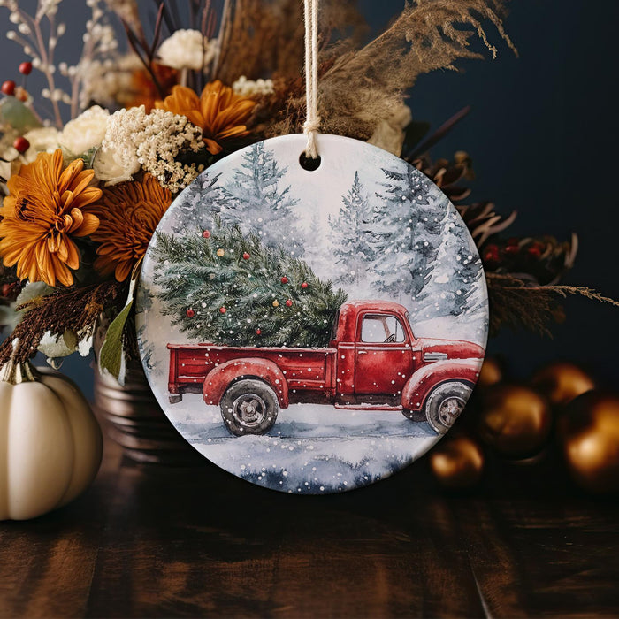 a red truck with a christmas tree on the back of it