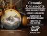 a ceramic ornament with a mountain scene on it