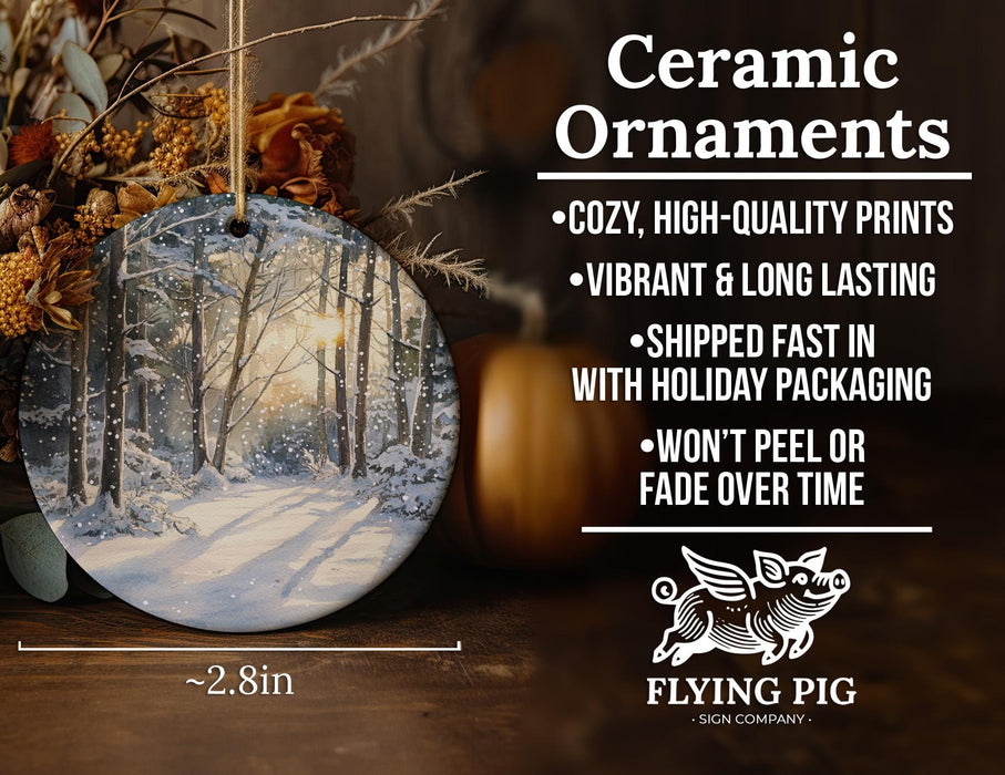 a ceramic ornament with a snowy forest scene