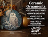 a ceramic ornament with an owl sitting on a branch