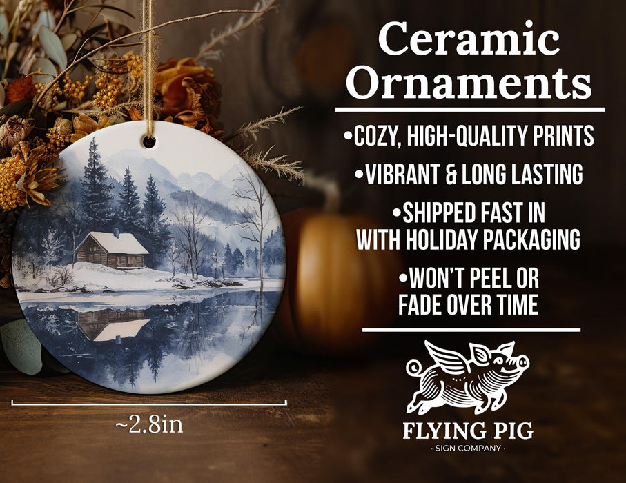 a ceramic ornament with a winter scene on it