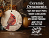 a ceramic ornament with a cardinal sitting on a branch