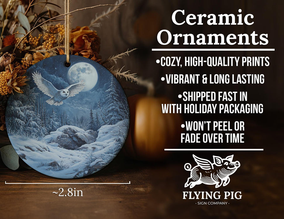 a ceramic ornament with an image of a snowy mountain scene