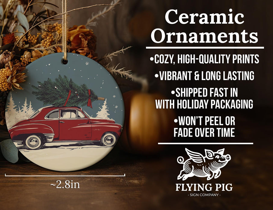 a ceramic ornament with a red car carrying a christmas tree