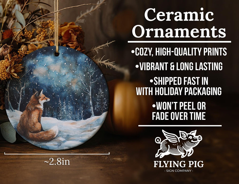 a ceramic ornament with a fox sitting in the snow