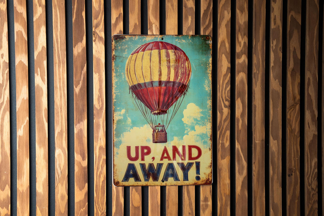 a sign that says up and away on a wooden wall
