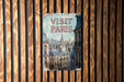 a sign on a wooden wall that says visit paris