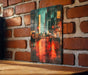 a picture of a cityscape on a brick wall