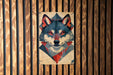 a painting of a wolf on a wooden wall