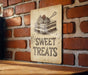 a sign on a brick wall that says sweet treats